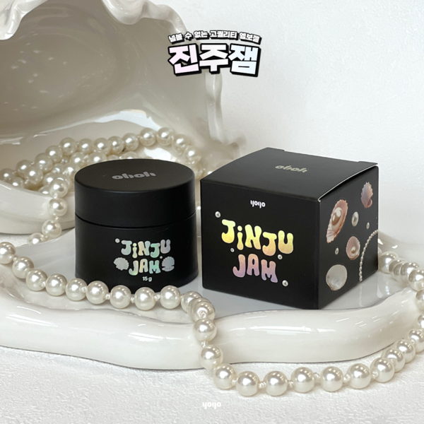 A close-up image of a cylindrical black jar with the "YOGO Pearl Jam" logo prominently displayed, surrounded by pearls and a decorative box with a similar branding. This visually appealing product image highlights the essential details of the YOGO Pearl Jam brand, providing a compelling representation of the 15g volume product.