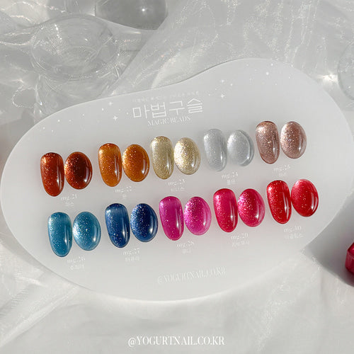 Vibrant array of colorful gel nail polish bottles showcasing a diverse collection of shimmering hues, perfect for creating glamorous and stylish nail designs for the YOGURT Magic Beads Collection.