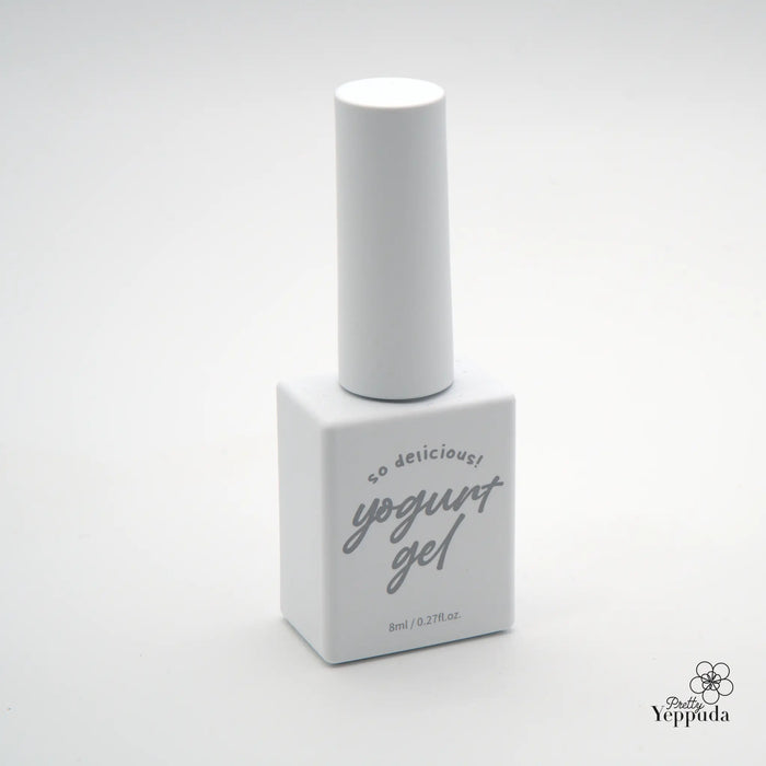 Detailed, visually descriptive alt text for the "YOGURT Grocery set 90 colors" Shopify product image: A white cylinder-shaped bottle with a gray label that says "so delicious! yogurt gel" resting on a white rectangular platform.