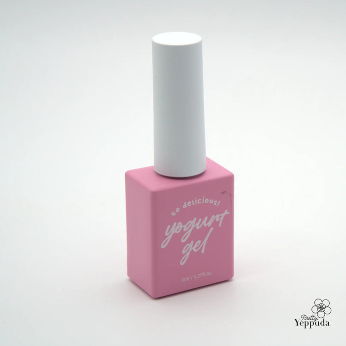 Detailed and informative image of a pink nail polish bottle with a white cap, highlighting the product's delicious and vibrant yogurt-inspired gel formula, part of the Yippuda brand's diverse color collection.