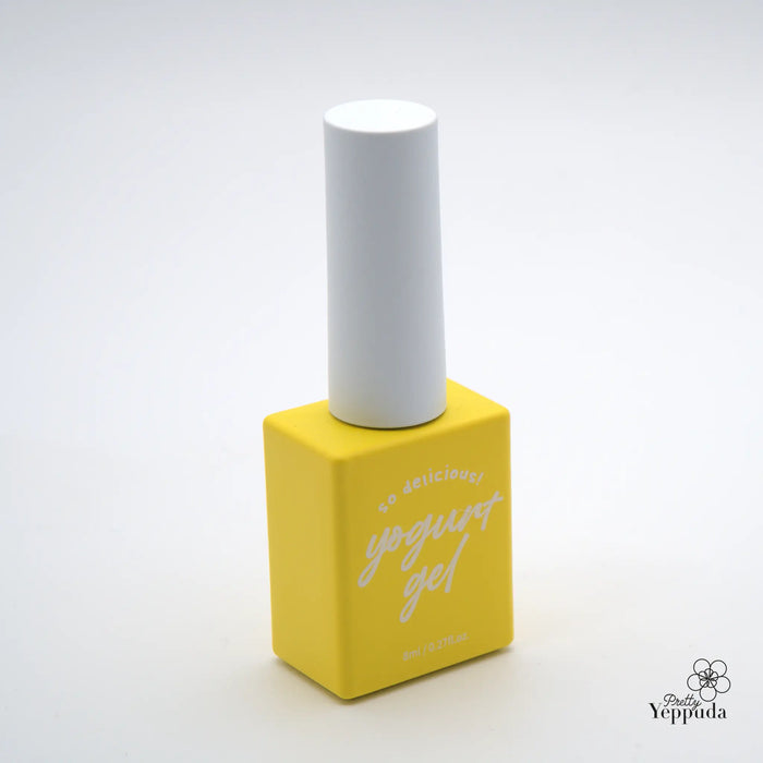 A vibrant yellow nail polish bottle with a white cap, showcasing a simple and minimalist design. The product appears to be a nail care item from the Yippuda brand, offering a variety of color options to enhance the user's manicure experience.