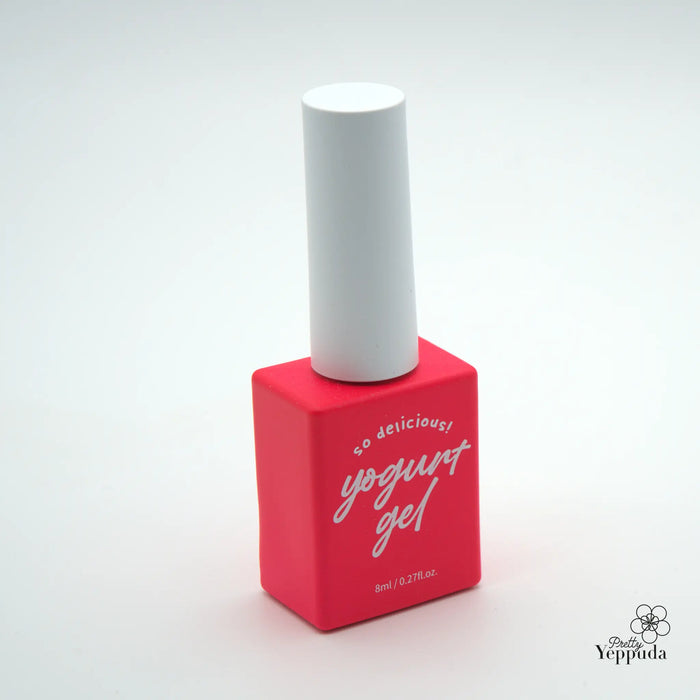 Vibrant red nail polish bottle with white cap, showcasing a simple yet stylish Yoplait grocery set product designed with 90 vivid color options, ideal for a modern, trendy aesthetic in the kitchen or home.