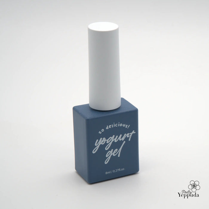 Descriptive alt text for the "YOGURT Grocery set 90 colors" Shopify product image: A simple and minimalist image showcasing a bottle of navy blue "yogurt gel" nail polish product, featuring the brand name "Yoppuda" prominently displayed on the bottle. The product is presented against a plain white background, highlighting its sleek and modern design.