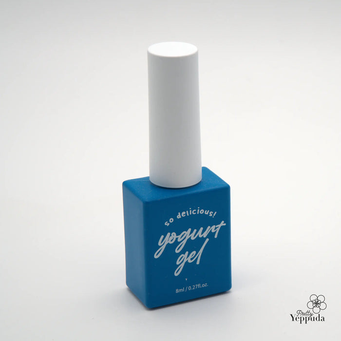 Descriptive alt text for the image of a Shopify product titled "YOGURT Grocery set 90 colors": A square-shaped blue bottle with a white cap on a white background, displaying the text "Yogurt gel" in cursive white lettering on the blue bottle. The product appears to be a grooming or beauty item, likely a yogurt-based gel or skincare product.