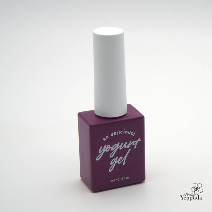 Detailed and informative alt text for the "YOGURT Grocery set 90 colors" Shopify product image: A square-shaped, deep purple-colored nail polish bottle with a white cap sits on a plain white background. The bottle features the text "so delicious! yogurt gel" printed on the front in a playful, cursive-style font. This nail polish product is part of a larger grocery-themed set containing 90 vibrant color options.