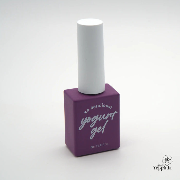 Elaborative alt text: A vibrant purple bottle with a white cap, containing a delicious yogurt gel product. The bottle's label prominently displays the brand name "Yogurt Gel" in a stylish script, conveying a sense of indulgence and quality. The minimalist design and the bold color palette contribute to the overall modern and appealing aesthetic of the product.