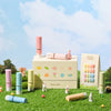 Detailed alt text for the image of the "LEAV Fairy Tale Collection with 8 Gels" Shopify product:

The image shows the Leav Fairy Tale Collection, which includes 8 pastel-colored syrup gel polishes in unique lipstick-style bottles. The set comes in special boxed packaging and features miniature rabbit figurines and floral decorations set against a grassy backdrop with a blue sky and fluffy white clouds. The product branding and collection name "Fa