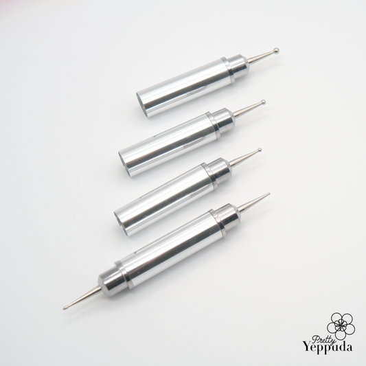 Set of four precision stainless steel dotting tools for nail art and crafts, featuring cylindrical handles of varying sizes and fine metal tips, arranged diagonally on a white background, ideal for creating intricate designs and patterns on nails or other small surfaces.