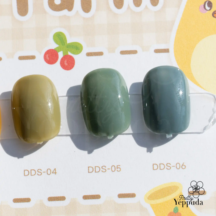Six rolling bottles in a minimalist, ombré design with a neutral color palette, perfect for the JIN.B Ding Gading - 6 PC collection, a Shopify product featuring custom stickers and a helpful chart, offering a modern, stylish storage solution for the discerning consumer.