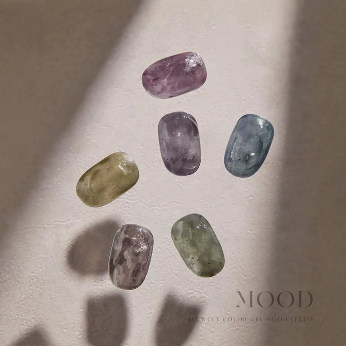 Vintage-inspired, colorful mood gels with a beautiful bottle design from the Jin.B Mood Collection, showcasing a variety of natural, organic-looking gemstone-like shapes and shades.