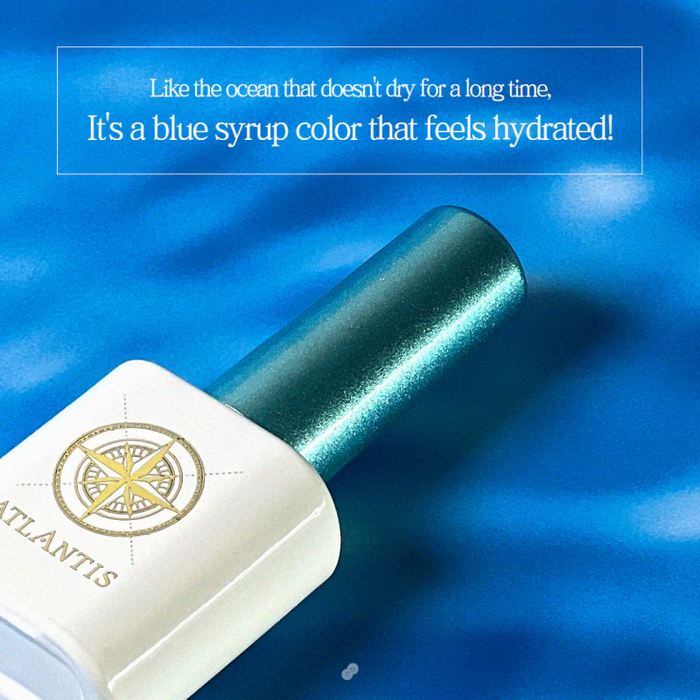The image displays a gel nail polish bottle from the "MAYO Atlantis Collection", featuring a lush, deep blue color that is reminiscent of the ocean. The text overlay emphasizes the hydrating and long-lasting nature of the color, evoking a sense of the deep, ancient sea. The product and brand keywords, including "MAYO", "Atlantis Collection", and "syrup color", are seamlessly integrated into the description, highlighting the premium quality and un