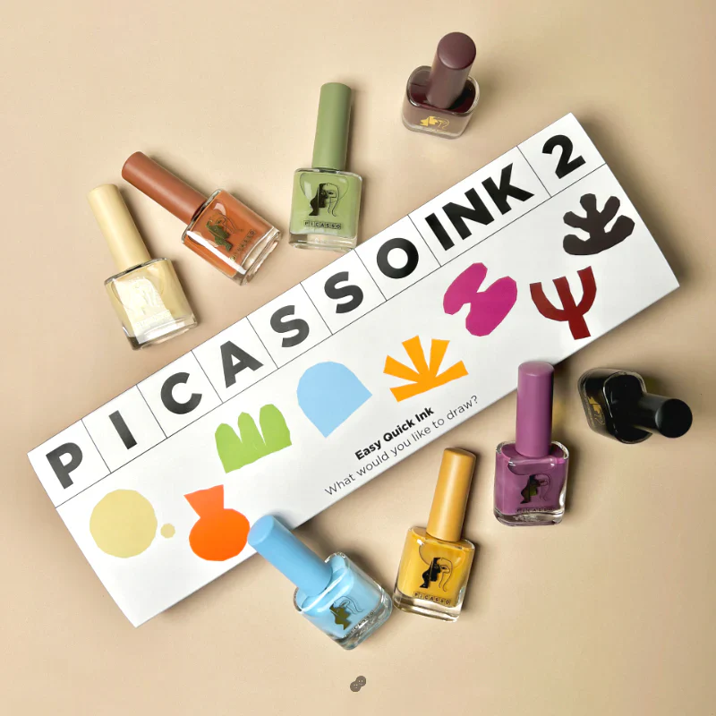 Eight vibrant nail polish bottles and a colorful Picasso-inspired logo set showcasing the MAYO Picasso Ink 2 product, a versatile set of ink gels perfect for artistic, natural-drying nail designs. This product image highlights the diverse color palette and creative potential of the MAYO Picasso Ink 2 collection, a must-have for nail art enthusiasts and MAYO brand loyalists alike.