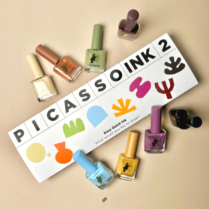 Eight vibrant nail polish bottles and a colorful Picasso-inspired logo set showcasing the MAYO Picasso Ink 2 product, a versatile set of ink gels perfect for artistic, natural-drying nail designs. This product image highlights the diverse color palette and creative potential of the MAYO Picasso Ink 2 collection, a must-have for nail art enthusiasts and MAYO brand loyalists alike.