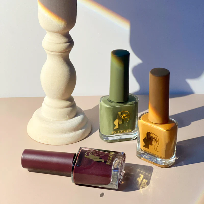 Eight vibrant nail polish bottles from the MAYO Picasso Ink 2 set are showcased, each containing a unique and captivating color. The bottles feature sleek, modern designs that complement the high-quality ink gels within, allowing for natural drying and a smooth application experience. This comprehensive MAYO Picasso Ink 2 collection offers consumers a diverse range of shades to express their personal style and creativity.