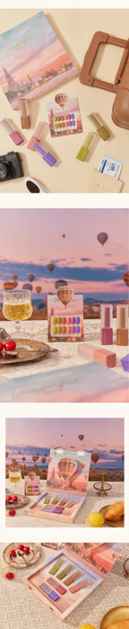 A vibrant and whimsical assortment of makeup products against a backdrop of hot air balloons, capturing the essence of the MAYOUR Wonderful Flying Collection. The product's varied shades and textures evoke a sense of imagination and adventure, perfect for elevating your nail game to new heights.