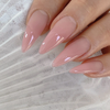 Detailed and elaborative ALT text for the image: "A close-up image showcasing a set of beautifully manicured nails in a light pink, gel-based polish. The nails are shaped into a chic, pointed style, creating a sleek and stylish appearance. This image perfectly highlights the high-quality Korean nail products from the NAILBAYO brand, including their DOI AUBE #04 gel polish, which is HEMA-free and offers a vibrant, long-lasting color. The attention