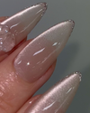Sparkling metallic nail polish with a magnetic effect, showcasing the trendy and sophisticated Nailbayo DOI Magnet Gel #4 product. The gel's shimmering finish and unique magnetic properties create a visually striking and eye-catching appearance, perfect for fashion-forward Shopify customers seeking innovative nail care solutions from the renowned Korean brand Nailbayo.