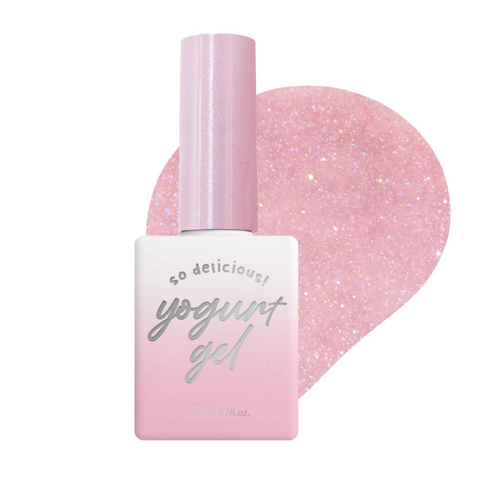 The image shows a bottle of Yogurt Ballerina 1 Collection gel polish from the Yogurt brand. The bottle has a reflective, glossy finish in a soft pink tone, with a wide, cylindrical shape. The product's name and description are visible on the bottle's label, indicating that it is part of a collection of 8 gel polishes that have a reflective effect when phone flash is used.