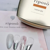 A sleek, minimalist bottle of RIPOSO Nuance Grip Gel sits atop a product brochure, showcasing the brand's dedication to high-quality nail care products that help users express their passion through beautifully nuanced nails. The gel's volume and cure time are clearly displayed, highlighting its functionality and ease of use.