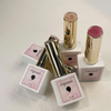 The image shows several products from the Riposo Veil Glinting collection, including syrup glitters and lipstick-like containers. The products feature a mix of subtle gold glitters and colors, conveying a classy and delicate feel. The glitters are described as fine, smooth, and premium, providing a soft application without the stiffness of chunky round gold glitters. The image showcases the variety and quality of the Veil Glinting products, highl