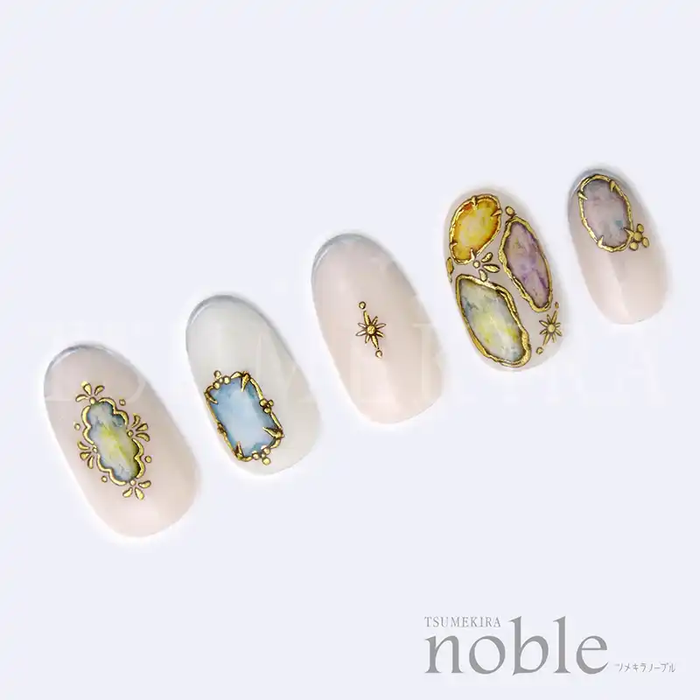 Decorative jewel-encrusted nail art stickers in a variety of colorful shapes and designs, showcasing the luxurious NOBLE JEWELRY collection by the Tsumekira brand. These statement nail accessories are designed for easy application over gel manicures, allowing users to effortlessly achieve intricate and glamorous nail art.