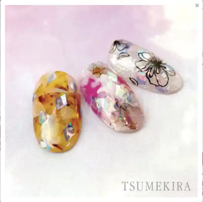 Decorative diamond-shaped aurora film stickers in vibrant colors and floral patterns, showcasing the Tsumekira brand's high-quality nail art and cosmetic accessories, perfect for embellishing nails, crafts, and DIY projects.