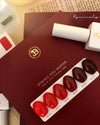 Elaborative ALT Text: The image showcases the "JIN.B IVY Yo So Sexy 6pc Collection," a special red edition nail lacquer set by the Jin.B brand. The set includes six different shades of red nail gels, packaged in a sleek burgundy box. The product description highlights the vibrant colors and the UV/LED curing time of 60 seconds. This cosmetic item is a must-have for fashion-forward and beauty-conscious individuals seeking a luxurious and on-trend 