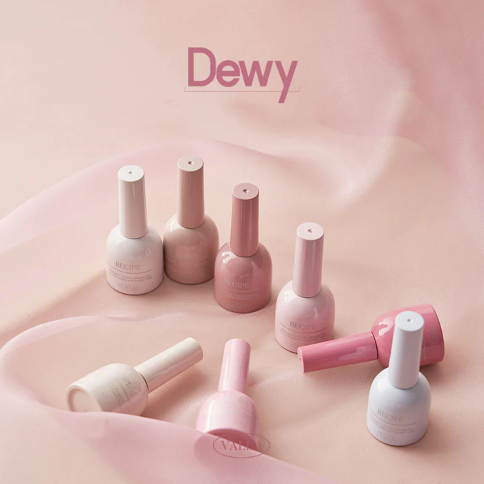 A visually striking display of the VALLA Dewy Collection, showcasing a range of silky smooth, trendy magnetic gel polishes in a soft, pastel color palette. The image highlights the high-quality finish and diverse shades included in this comprehensive set, enticing customers with the promise of a flawless, salon-worthy manicure.