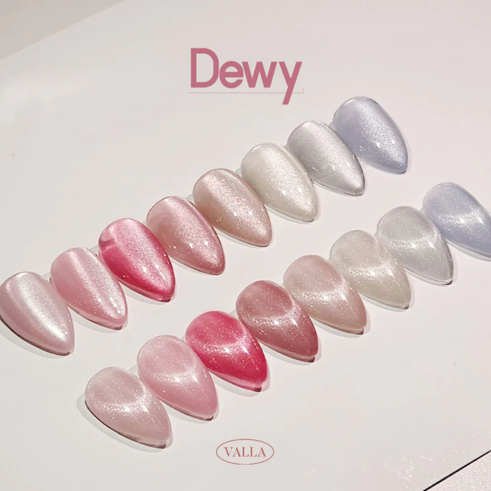 A colorful and visually appealing display of the VALLA Dewy Collection, featuring an array of shimmering, pearlescent gel nail polish shades ranging from soft pinks to silvery grays, creating a sophisticated and trendy "cat eye" effect.