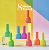 Image of a vibrant, colorful display showcasing the "VALLA Neon Trend Collection" featuring 8 neon-colored nail polish bottles. The products highlight the latest trend in Korea - neon nails, allowing users to dare to shine with the 10ml bottles that cure within 1-2 minutes under UV/LED light. The image prominently displays the brand name "VALLA" and the collection title "Neon Trend".