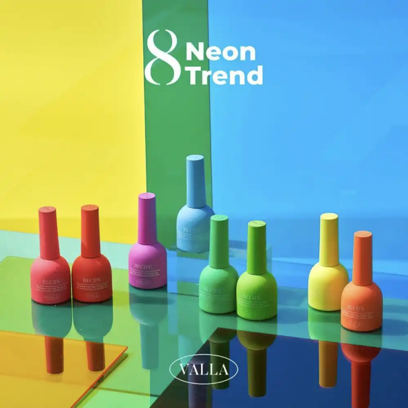 Vibrant neon nail polish bottles showcased on a reflective surface, representing the 2024 Korean nail trend of bright, eye-catching colors. The image highlights the VALLA Neon Trend collection, featuring 8 unique shades available in sets or individually. This product image captures the bold, trendy aesthetic of the VALLA brand, inviting customers to embrace the latest neon nail color craze.