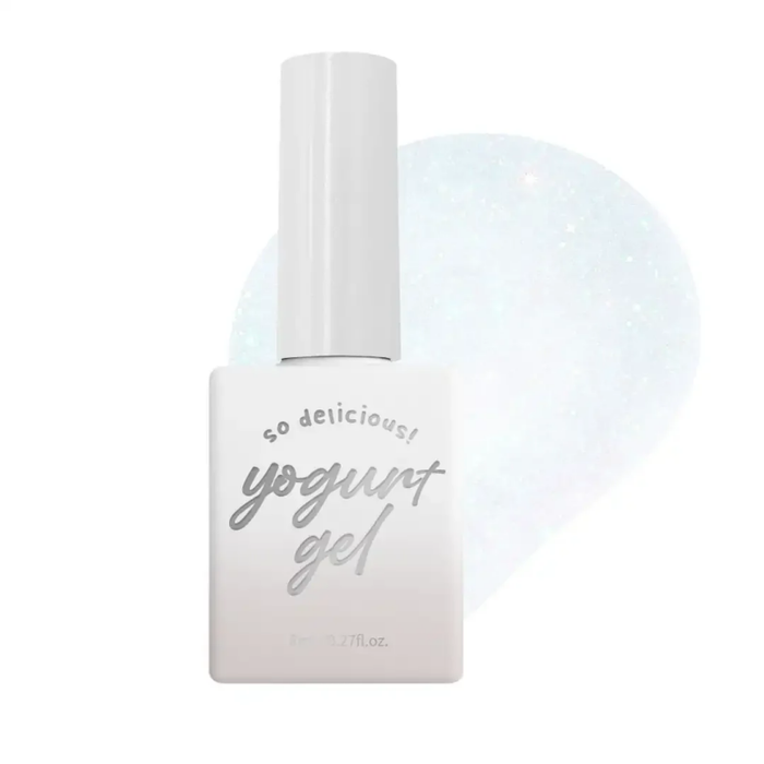 Detailed image of a white bottle labeled "Yogurt gel" against a blurred light background, showcasing the product's tropical mermaid reflective shades that shine brightly under light. The gel is part of the Ballerina 2 Collection, following the success of the first Ballerina collection. The product details indicate that it is a single gel available in various colors, with a volume of 8ml and a cure time of 60s under UV/LED light.
