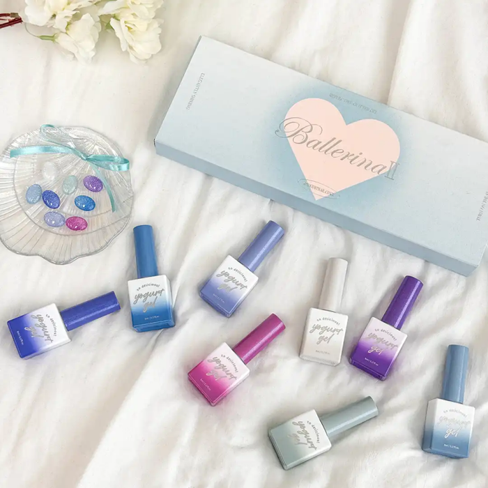 Colorful and whimsical nail polish collection featuring tropical mermaid and reflective shades from the Ballerina 2 product line, showcasing the vibrant and shimmering hues that are perfect for creating a fun, elegant manicure.